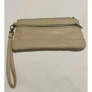Adrienne Vittadini cream clutch bag with zipper and wrist strap